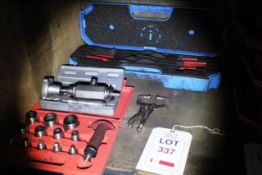 Two assorted hole punch kits and a SKF HN4-16/set