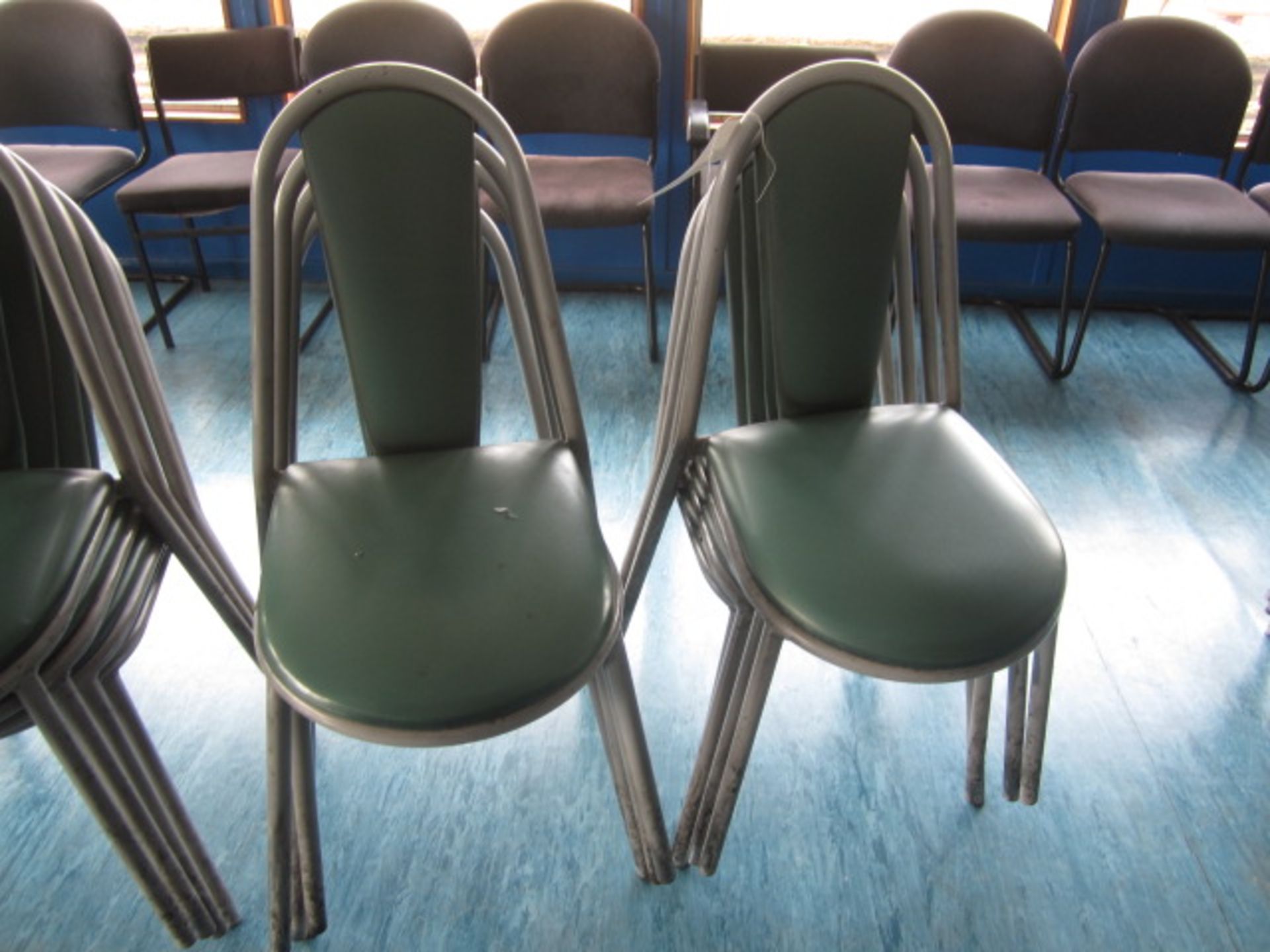 Eight metal frame vinyl stacking canteen chairs