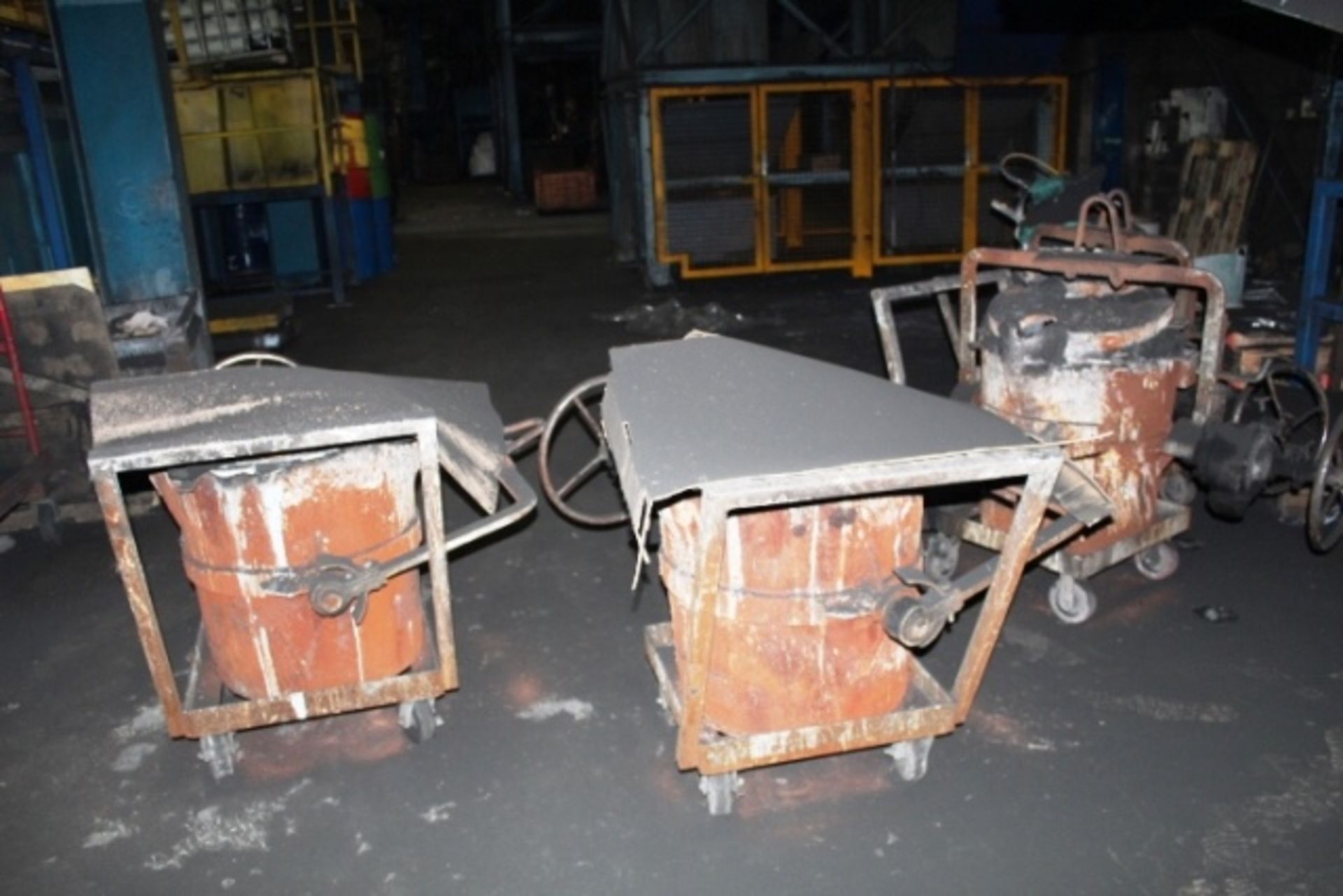 Six mobile fitting molten metal pouring ladles/pots (Should you wish a quotation for lift out of