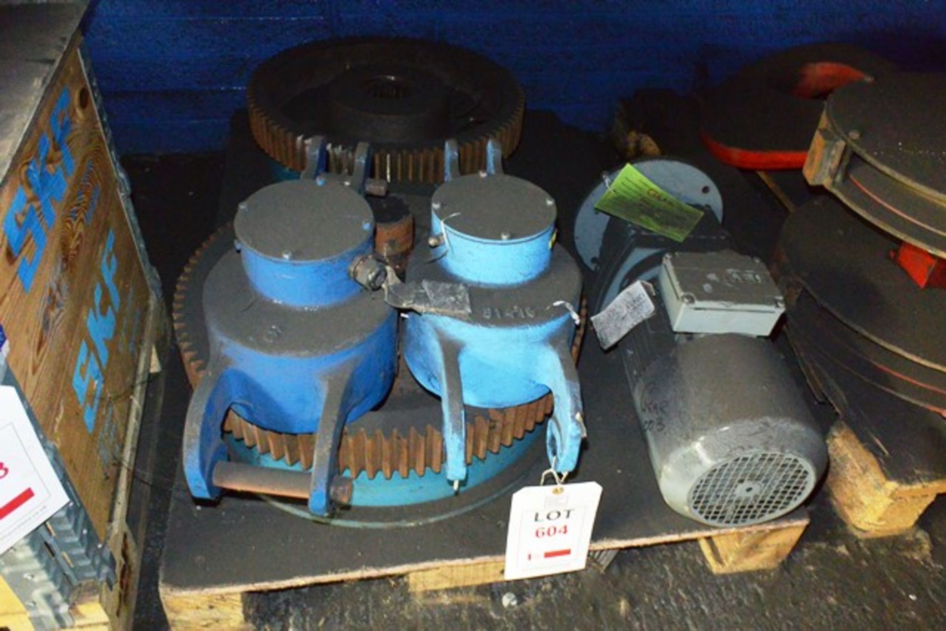 Contents of pallet to include SEW electric motor and fitted gear, steel gantry cogs, etc.
