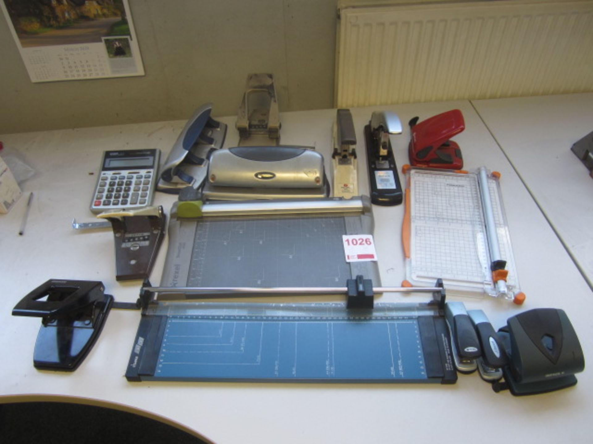 Assorted paper guillotine, hole punchers, staplers, etc.