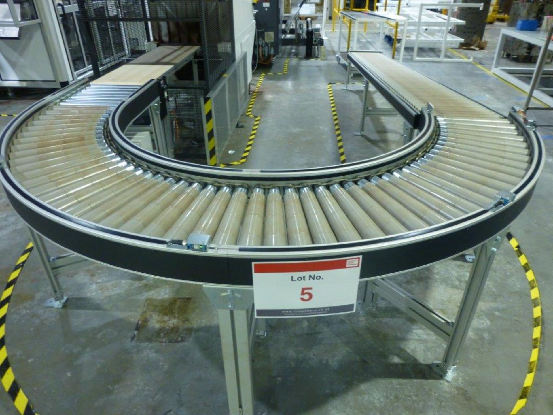 180 degree 415mm wide powered roller conveyor with 4m x 415mm wide gravity fed decline roller