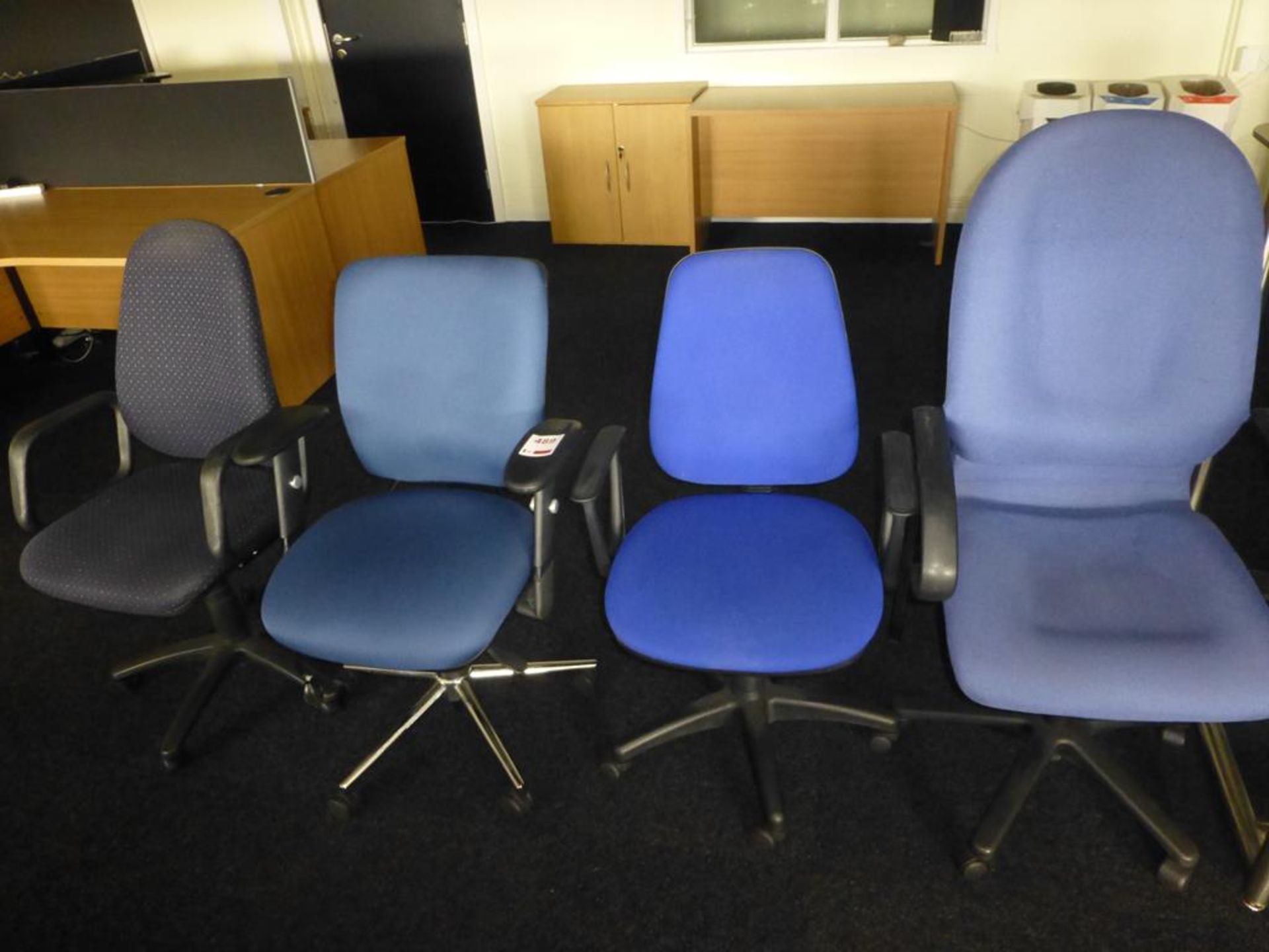 4 assorted fabric upholstered swivel chairs