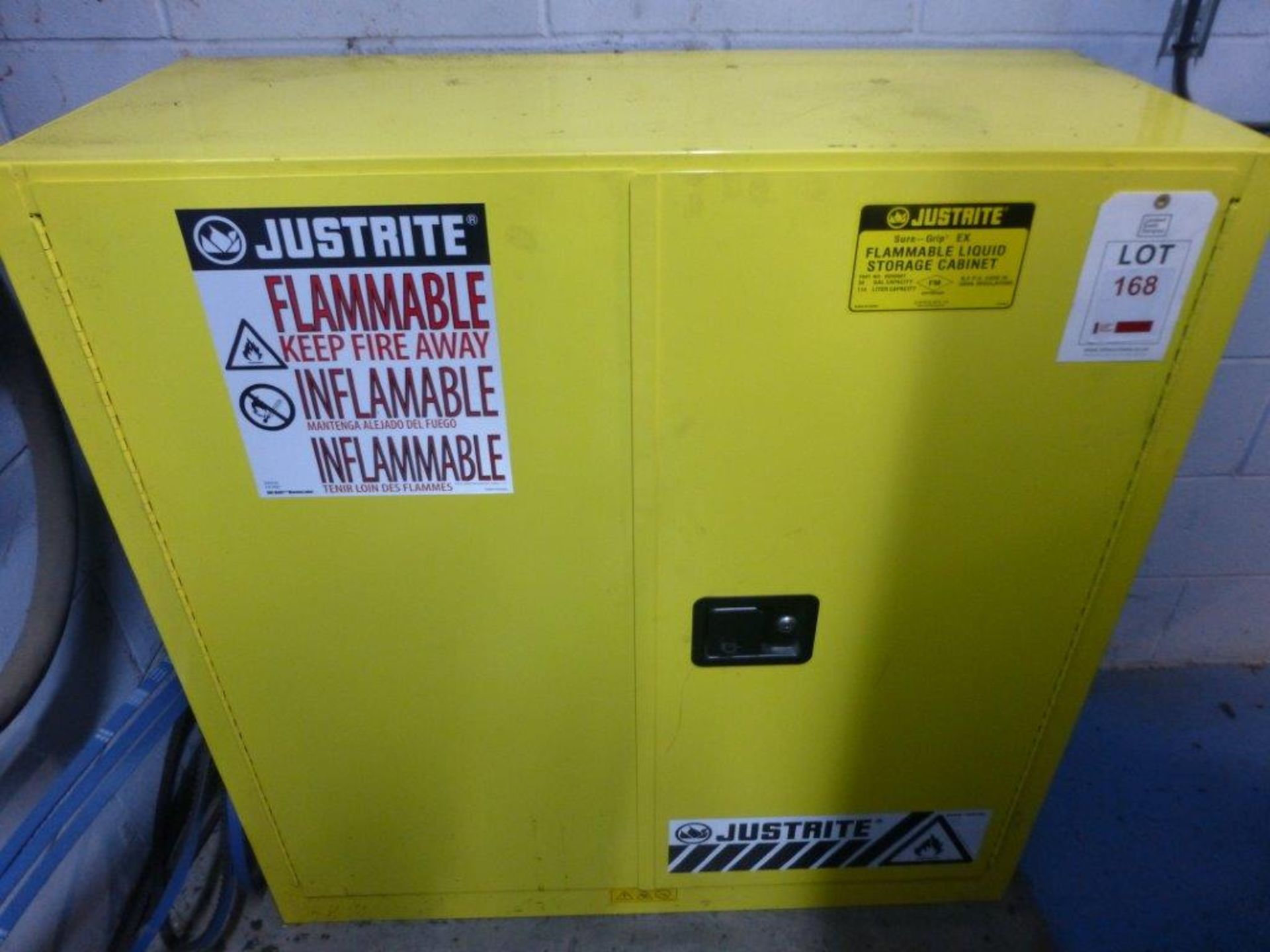 Justrite 1090mm x 460mm x 1120mm steel double door flammables storage cabinet, located on first