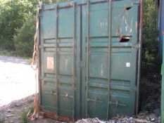 40ft export type shipping container and contents (please note: heavily damaged with various dents