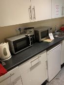 Contents of kitchen including 2 x microwave ovens, 1 x Café Mattino coffee machine, toaster,