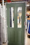 Green UPVC timber effect door, with side panel and double glazed units, approx 2080x900mm (please