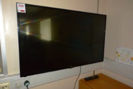 JVC wall mounted 49" LCD flat screen TV, with remote (please note: this lot is located at the