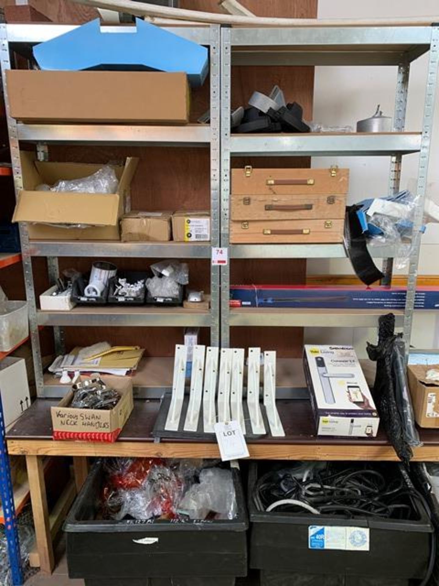 As lotted contents of rack and 3 plastic tubs, handles, brackets, guttering parts, gasket (please