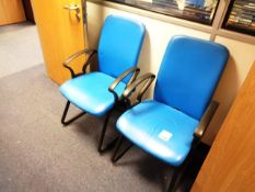 Two blue leather effect armchairs
