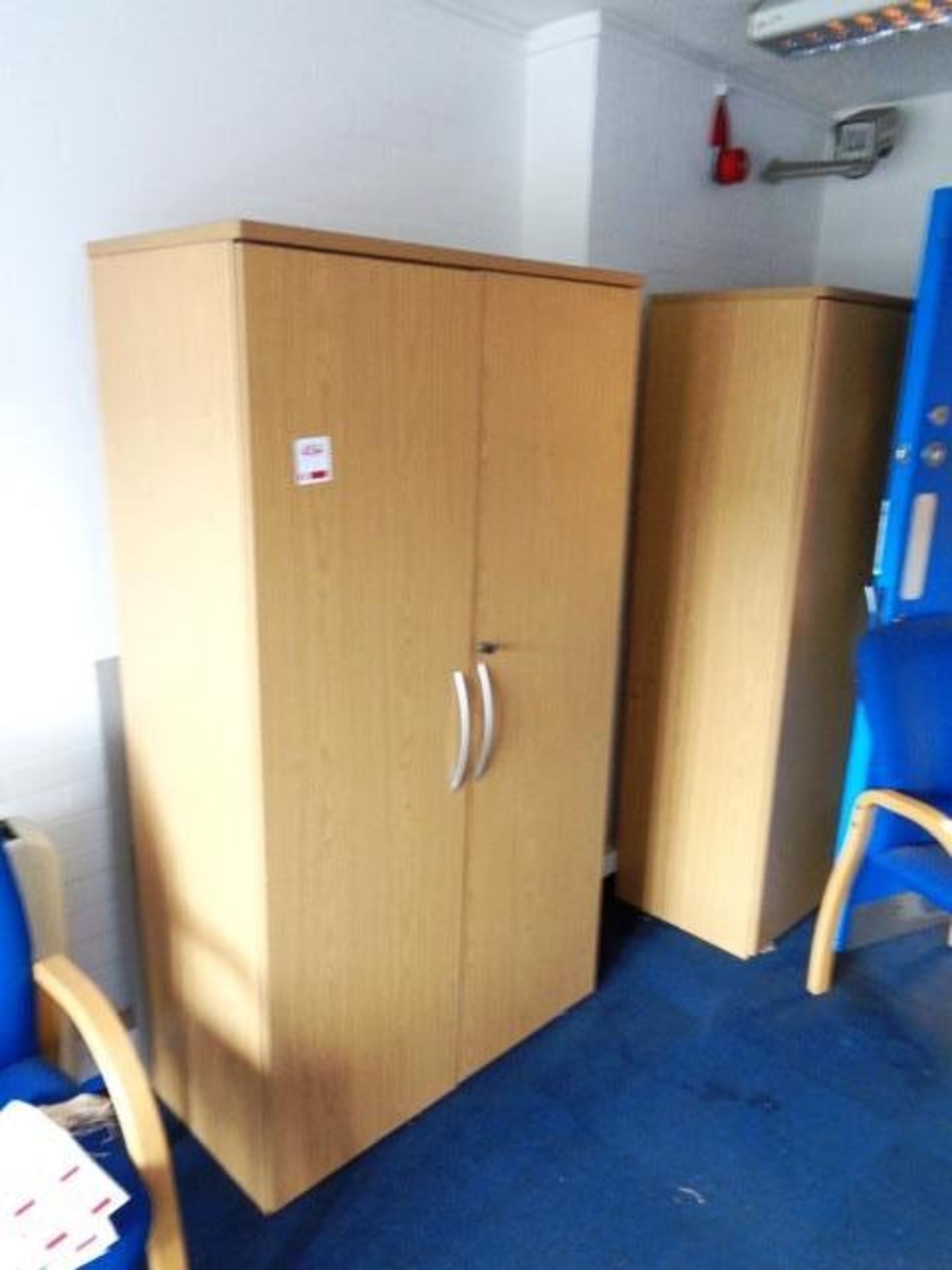 Two light wood twin door filing cabinets and four blue cloth upholstered static armchairs