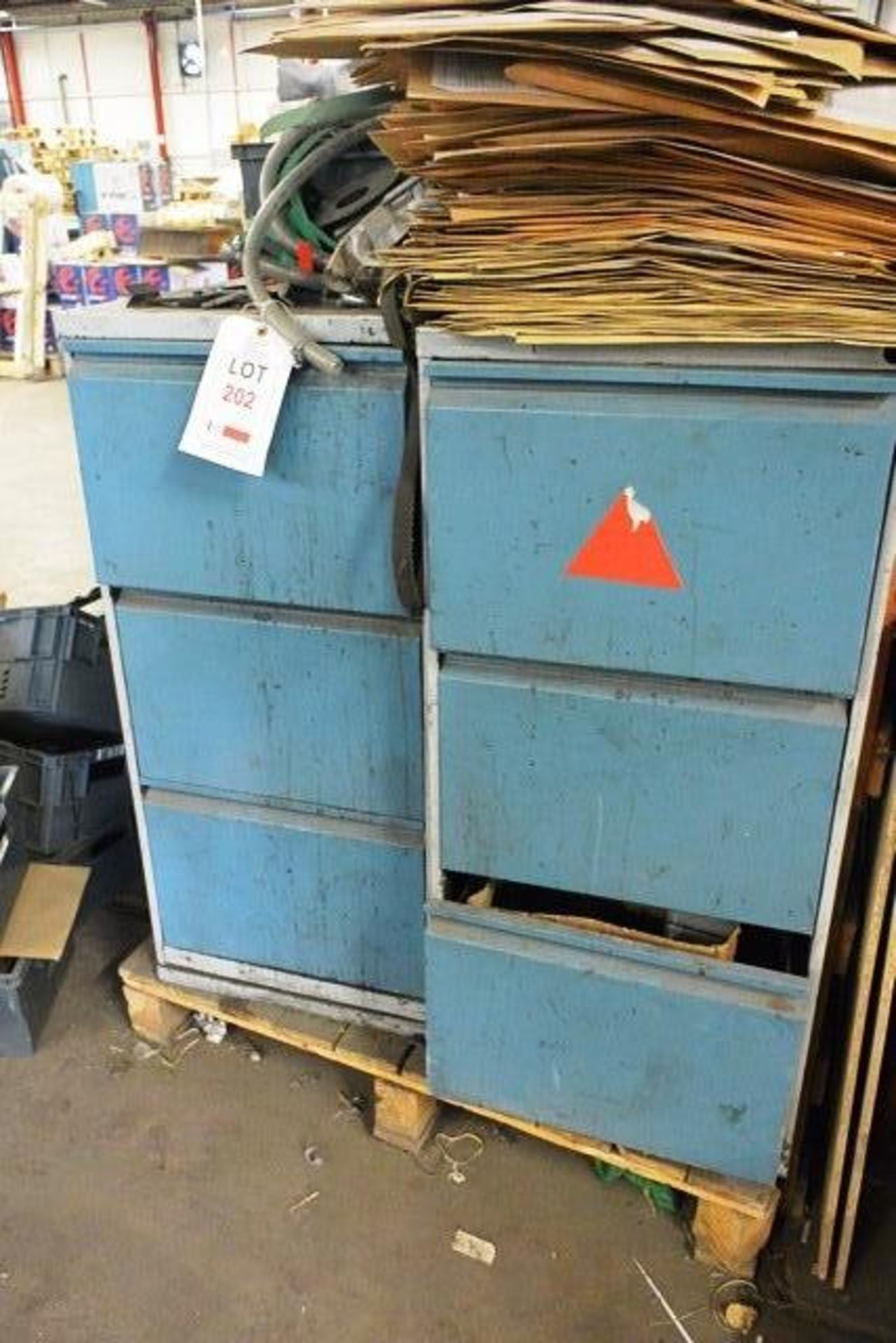 Two steel frame 3 drawer filing cabinets including contents, to include various spare parts,