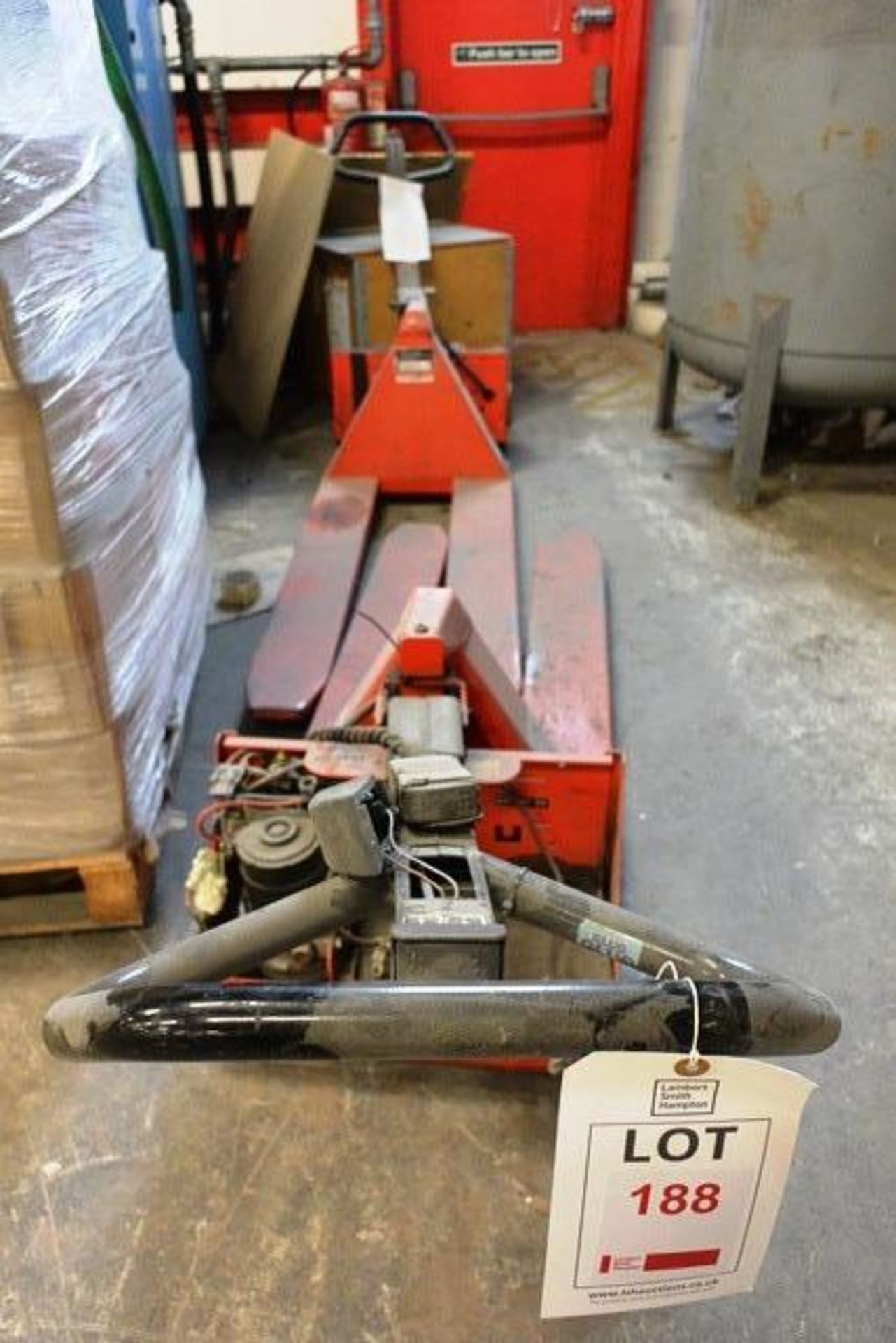 Two out of commission battery powered pallet trucks (no batteries included, sold as spares or