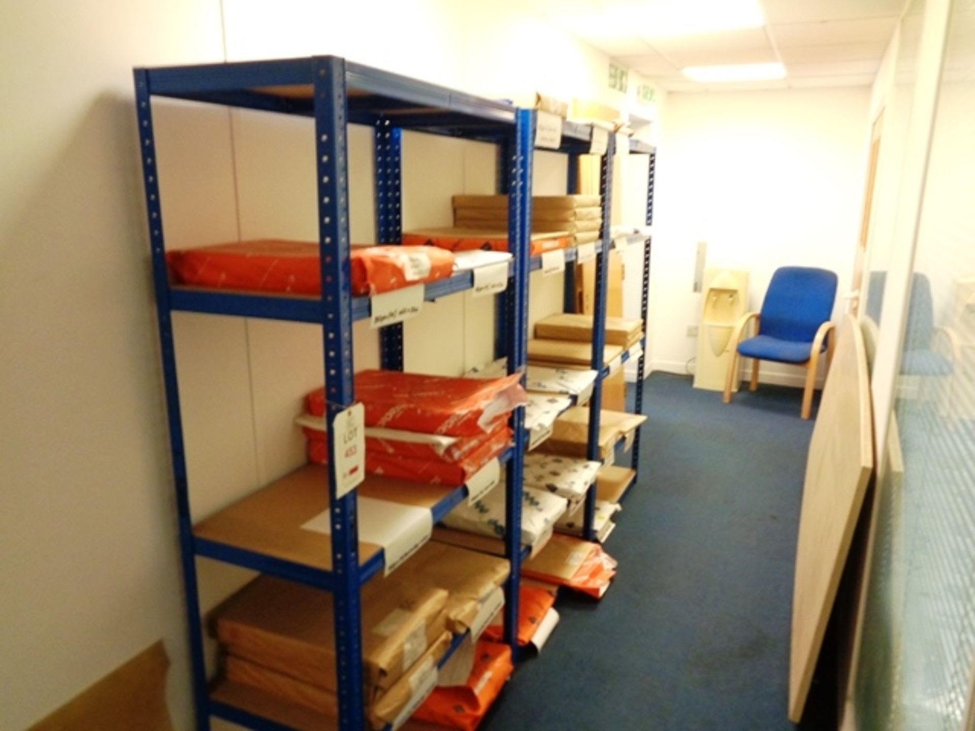 Three bays of blue adjustable stores shelving and quantity of assorted part used paper ream stock