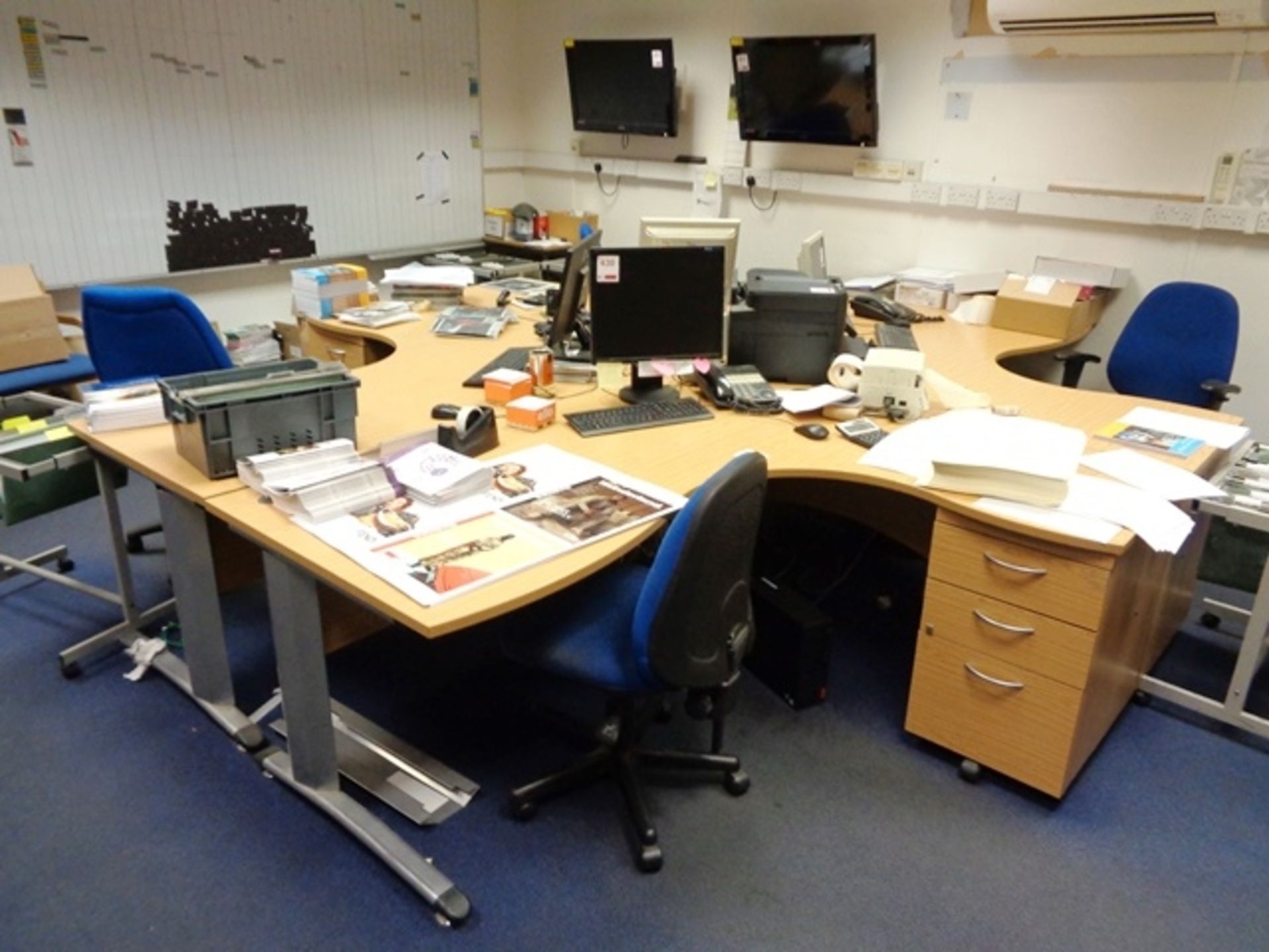 Four light wood effect L shaped office desks (1 x 4 section pod) with integrated 3-drawer pedestals,