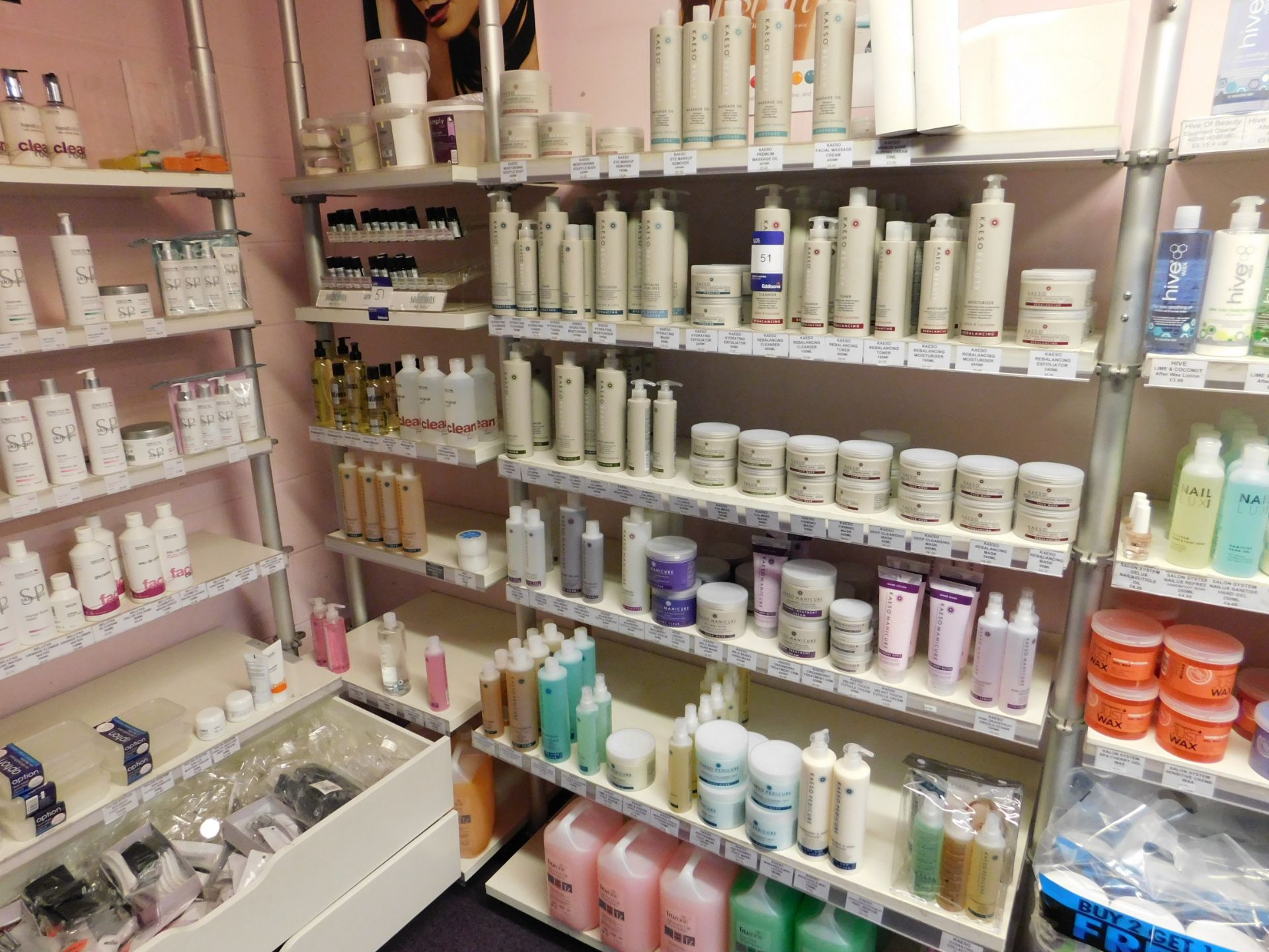 Assortment of beauty treatment products to shelving, including toner, hand treatment cream,