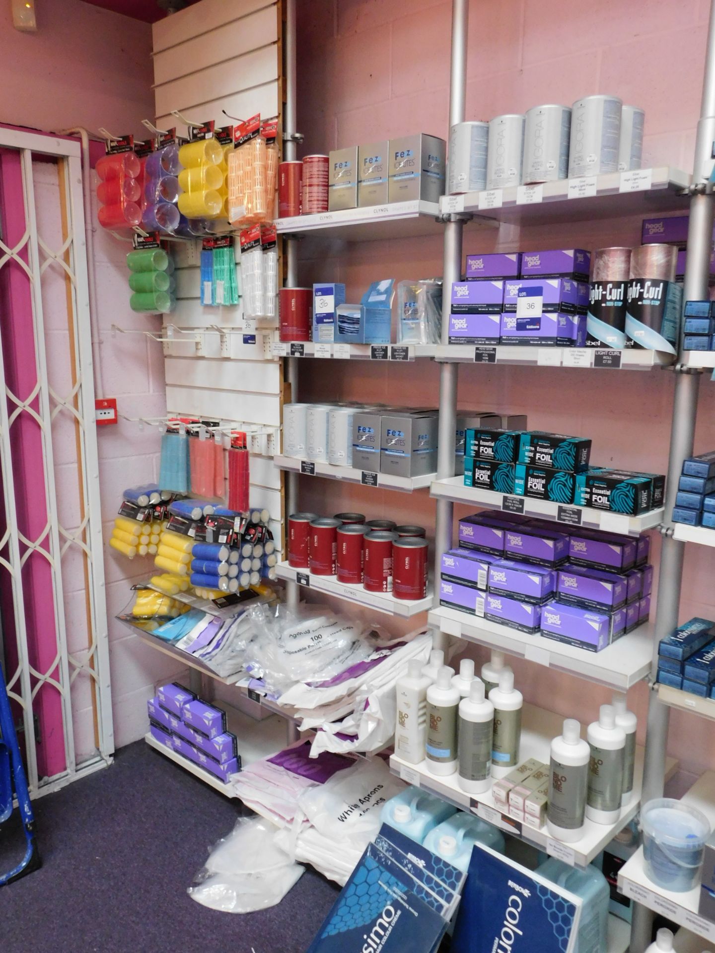 Contents to 1 bay of shop display shelving, to include an assortment of hair colour products, and