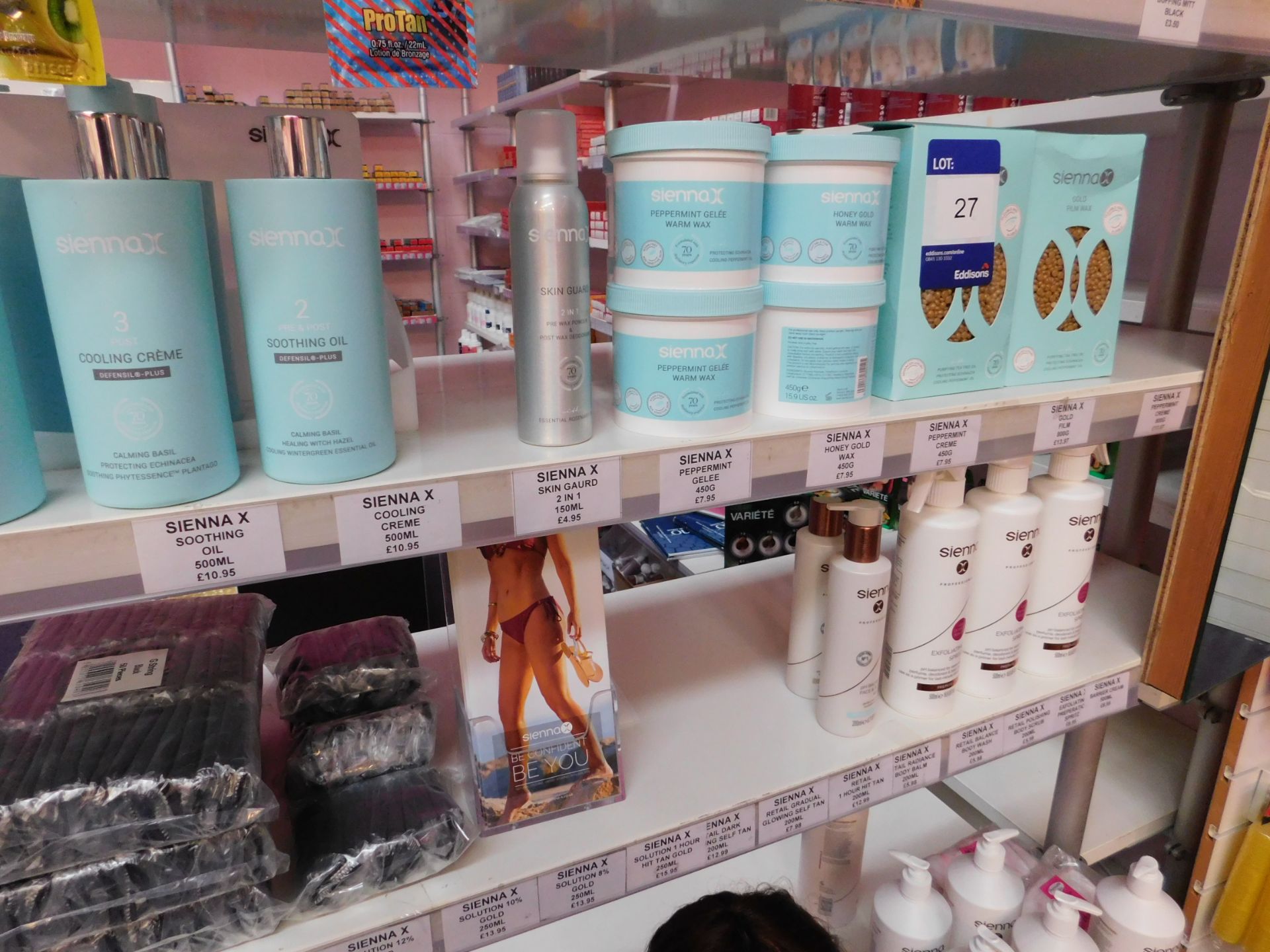 2 x Bays of shop display shelving and contents, including assortment of tanning products (tan - Image 4 of 5
