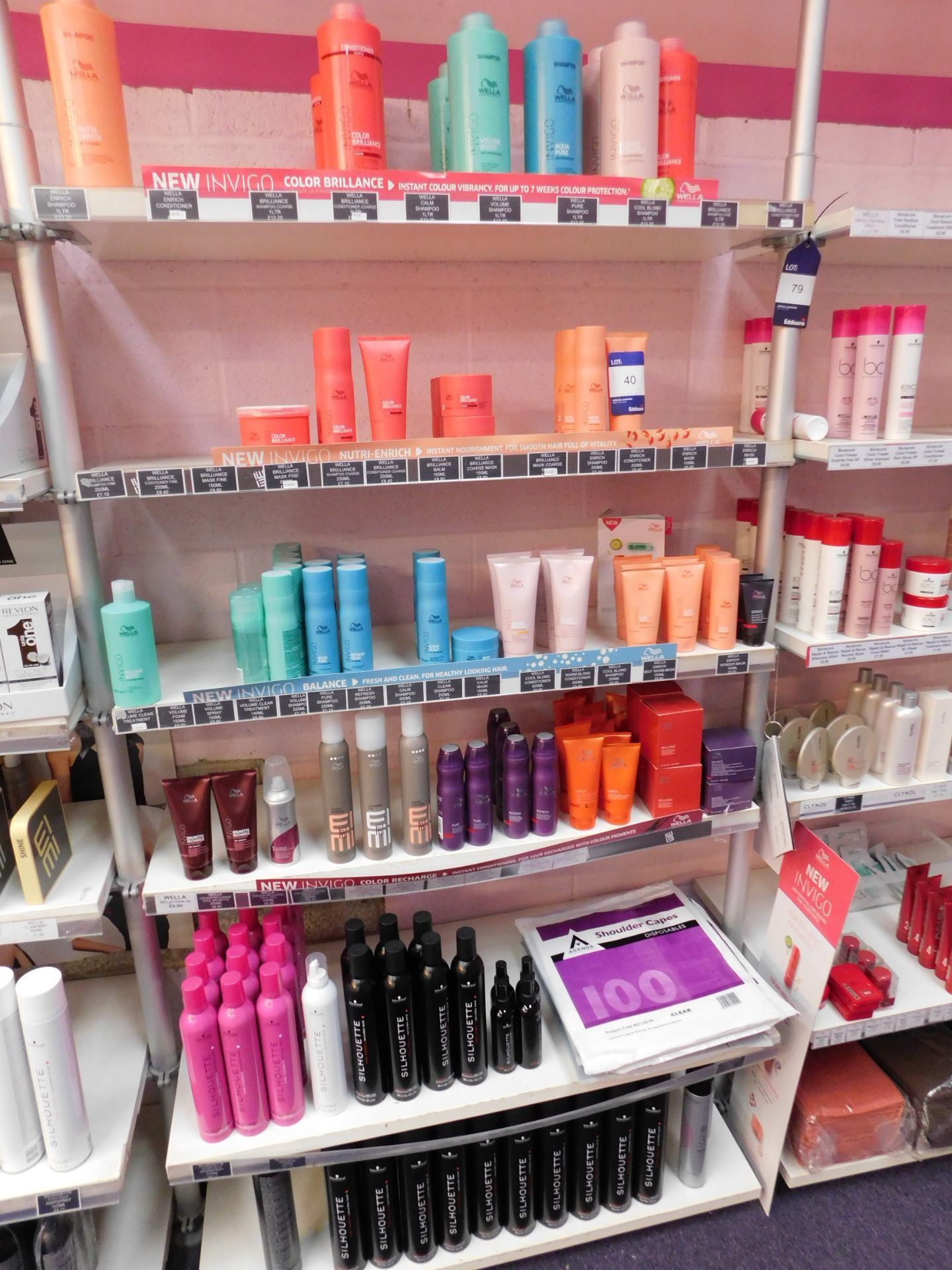 Contents to 1 bay of shop display shelving, to include assortment of Wella hair products