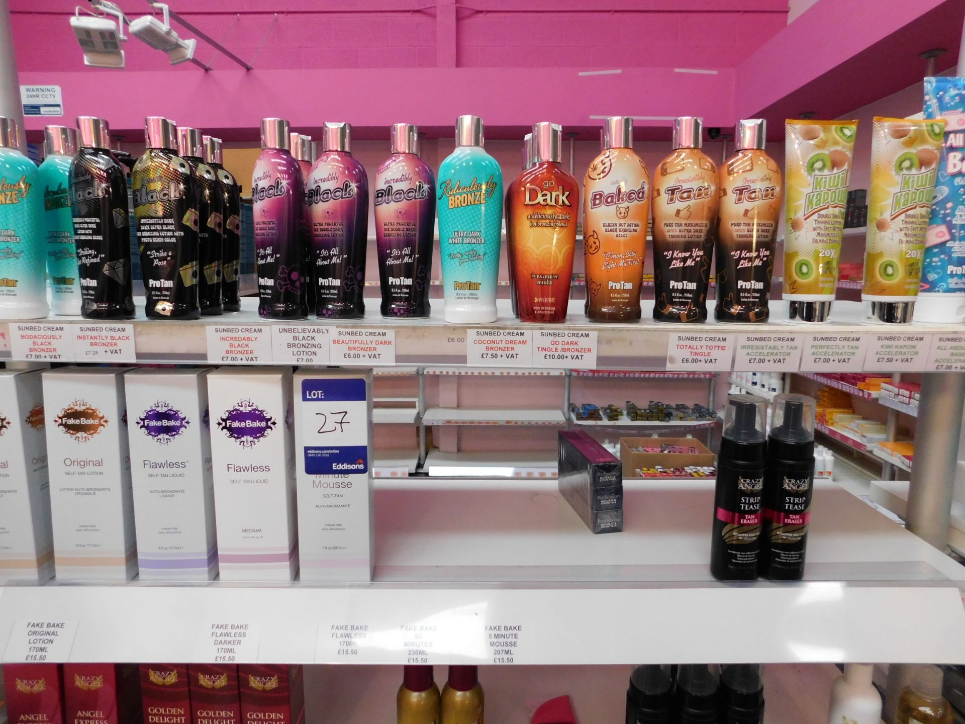 2 x Bays of shop display shelving and contents, including assortment of tanning products (tan - Image 2 of 5