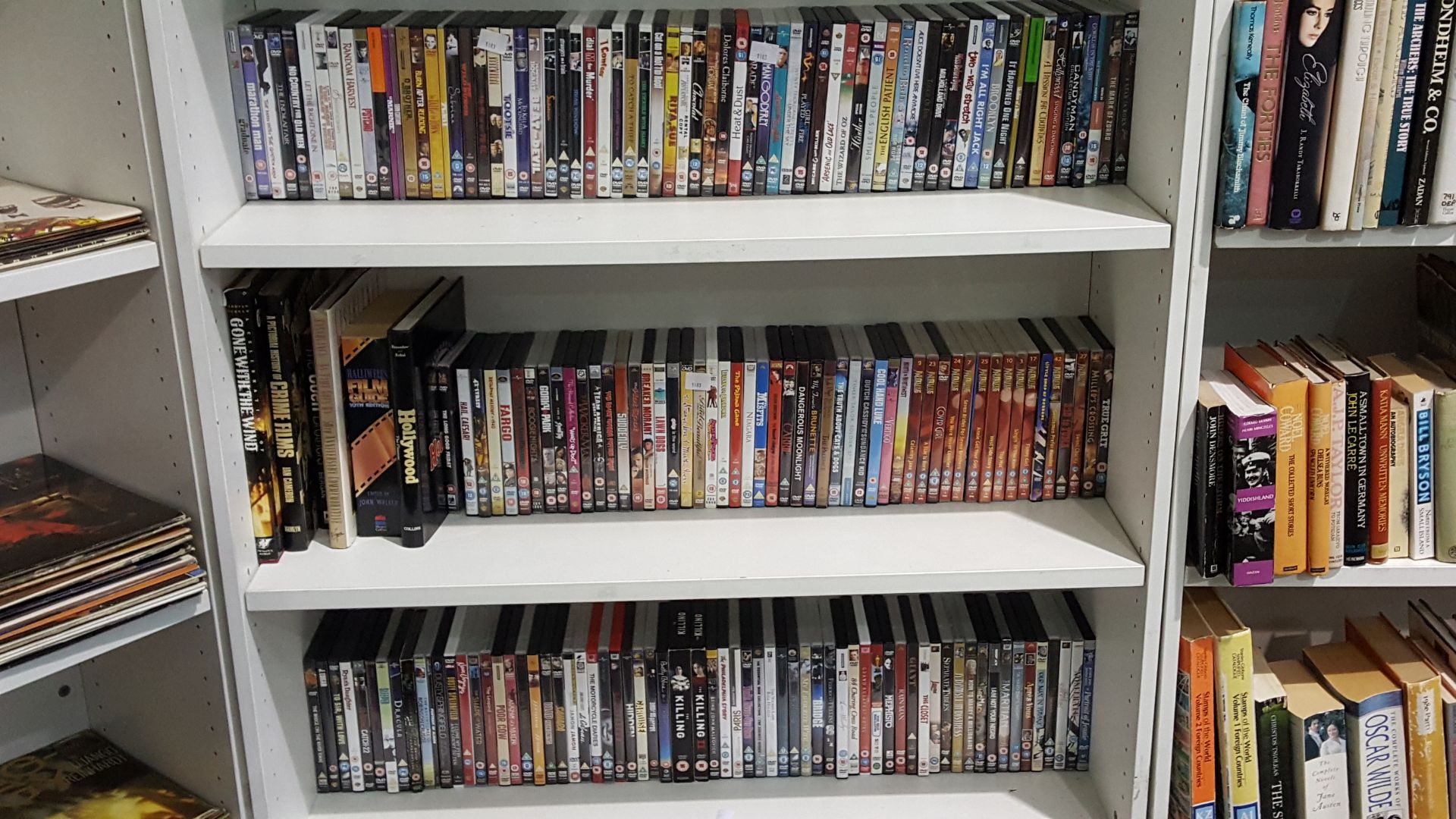 Three shelves to contain assorted DVDs