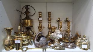 A Shelf containing an Assortment of mainly Brasswa