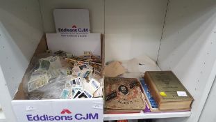 A Shelf containing Assorted Cigarette Cards and St