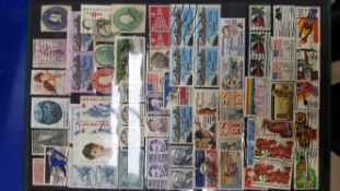 Assorted International Stamps in folders/books