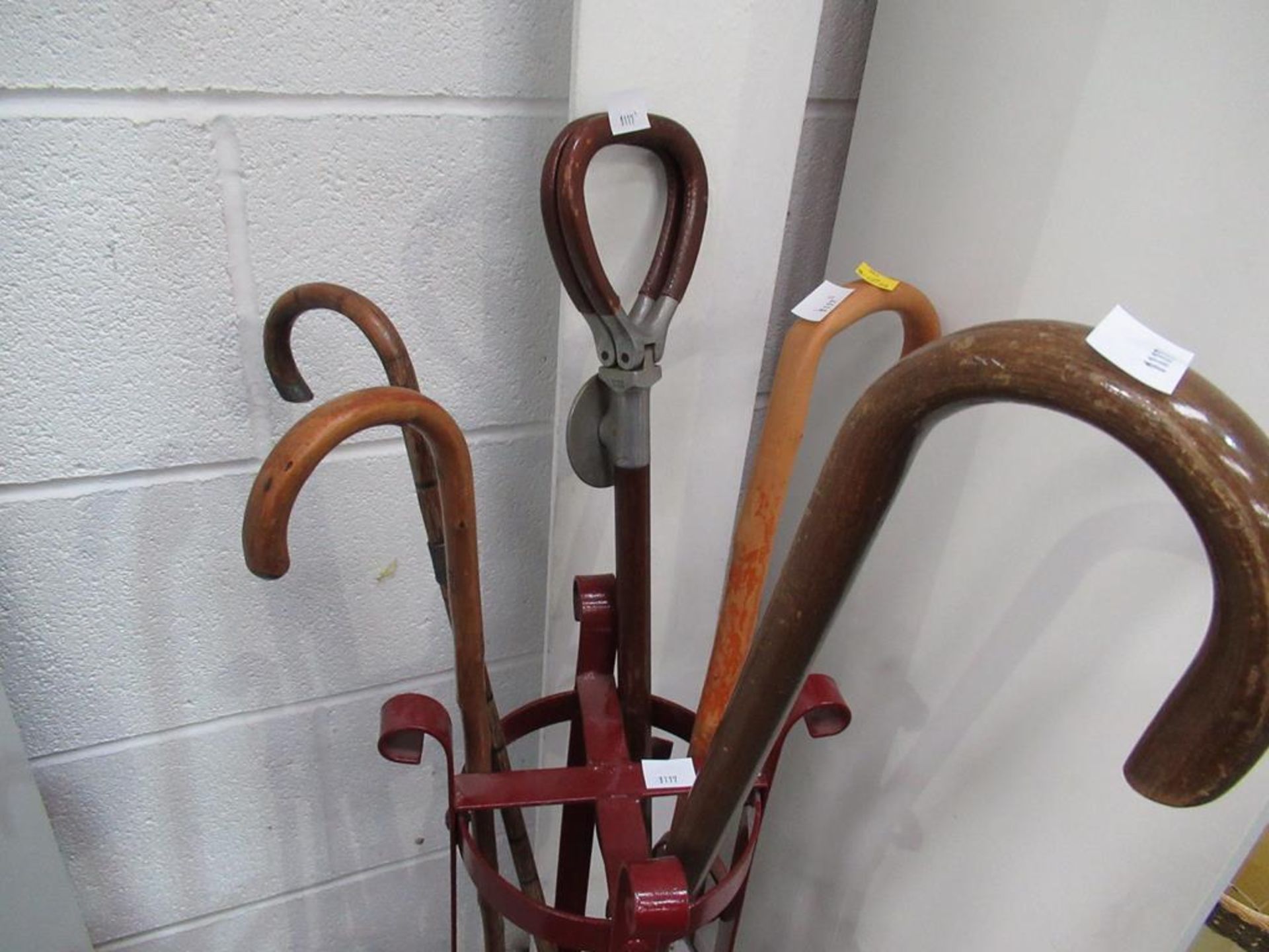 Red painted metal stand with four walking sticks & a shooting stick - Image 3 of 3