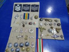 A total of three cards with military Badges, Buttons, Ribbons etc.