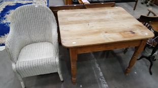 A Pine Kitchen Table and Lloyd Loom Chair