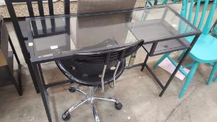 A glass topped Computer Desk with single shelf together with chair