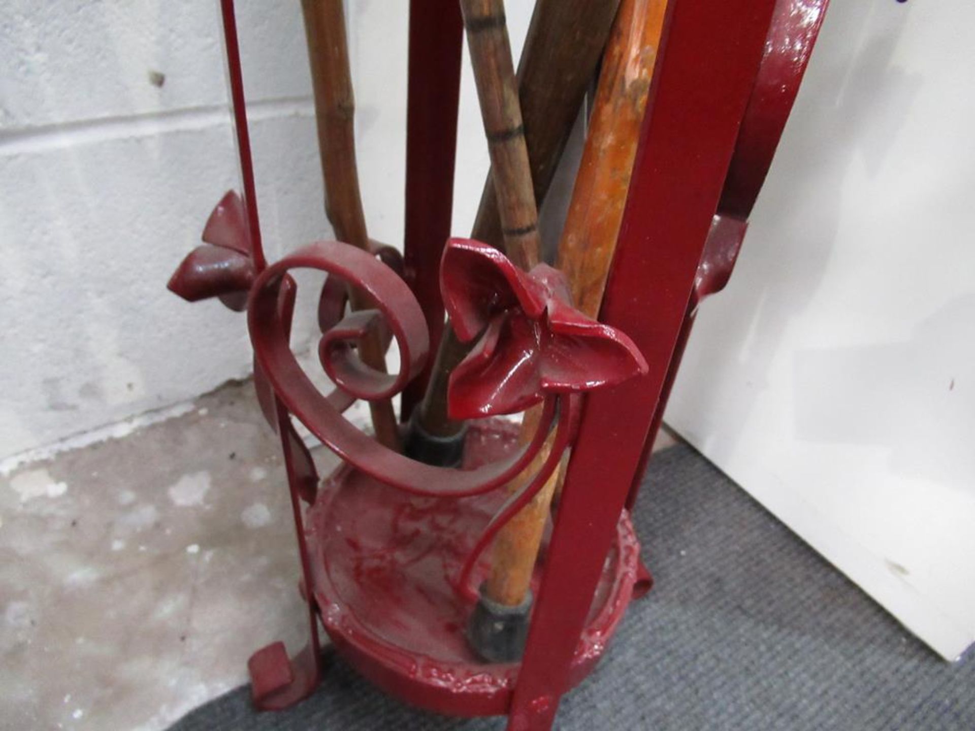 Red painted metal stand with four walking sticks & a shooting stick - Image 2 of 3