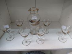 A Glass Decanter with Six Stem Glasses