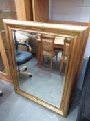 Gold coloured framed bevel edged mirror