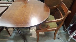 An extending Dining Table with five Dining Chairs