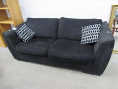 A Black Bed/Settee with Scatter Cushions