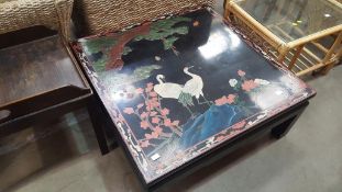 Large dark coffee table with oriental style scene