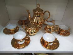 A Mirrored Gold Finish Coffee Set
