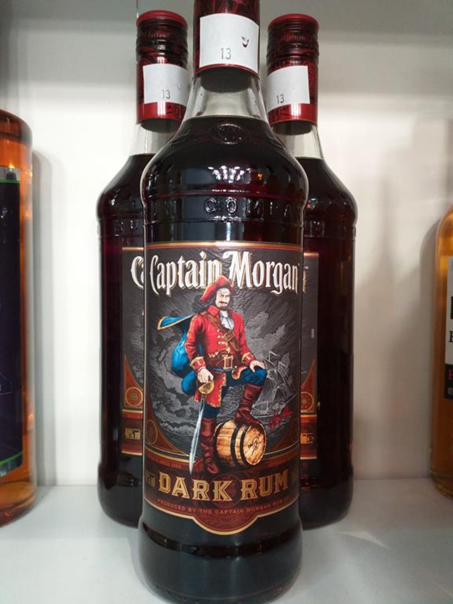 Three bottles of Captain Morgan Dark Rum, a bottle of Wood's Old Navy Rum, two bottles of Mount Gay - Image 2 of 5