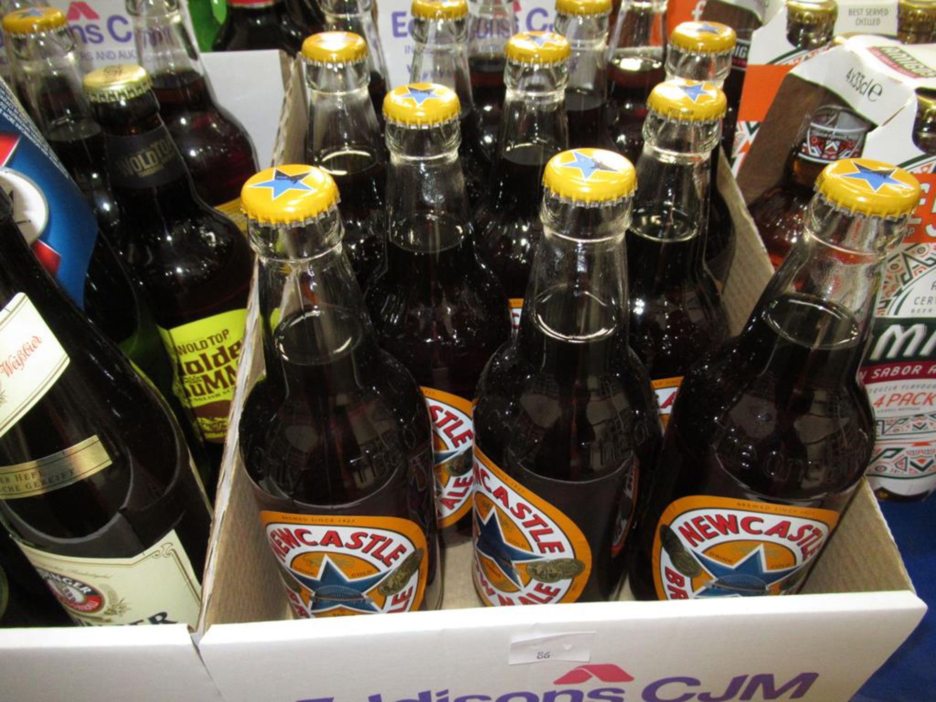 A Qty of bottles drinks to include Theakston Light, Wainwright beer, Newcastle Brown Ale, Hooch, Cor - Image 2 of 8