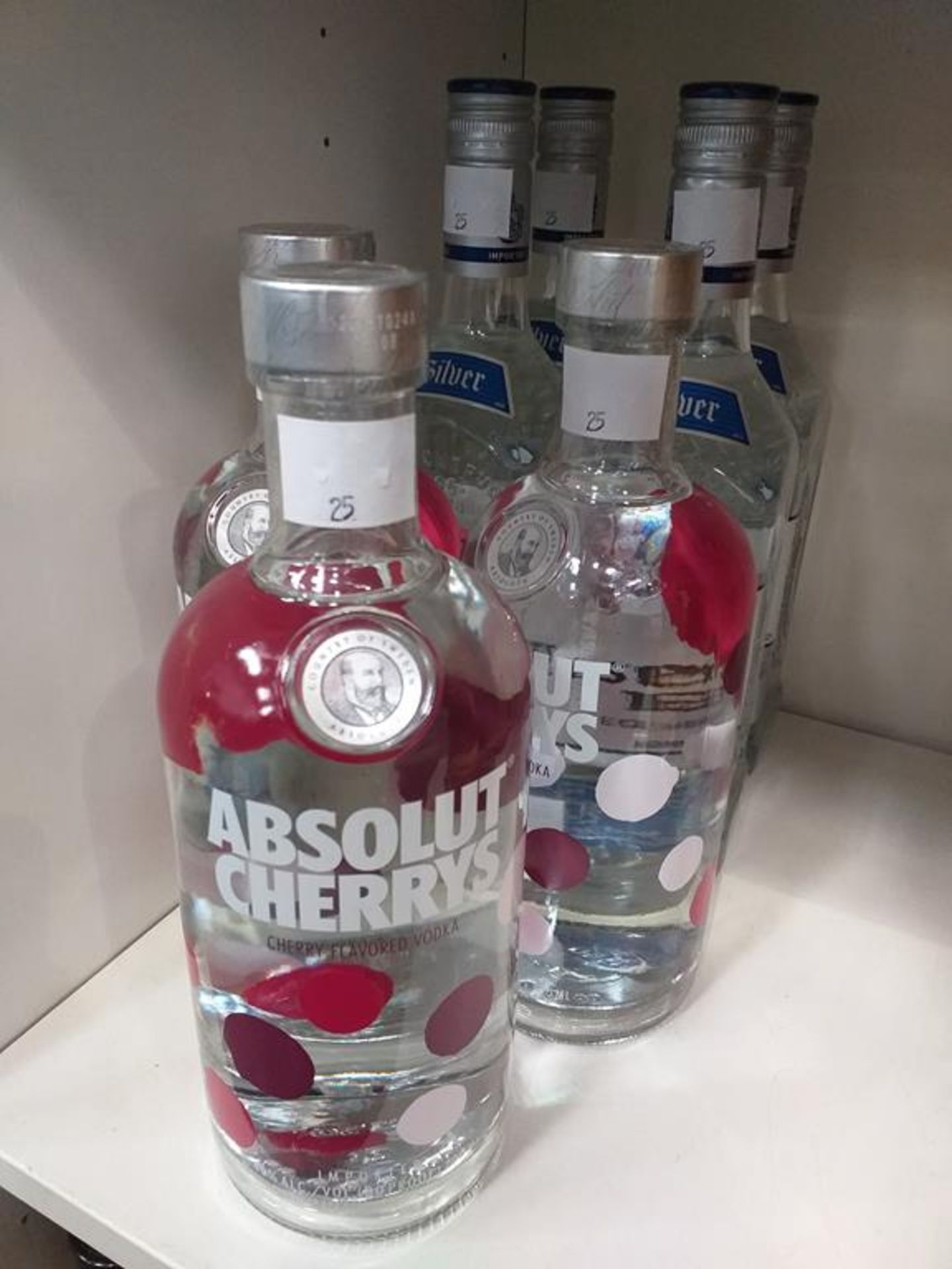 Four bottles of Jose Cuervo Especial Tequila Silver and three bottles of Absolut Cherry's Vodka