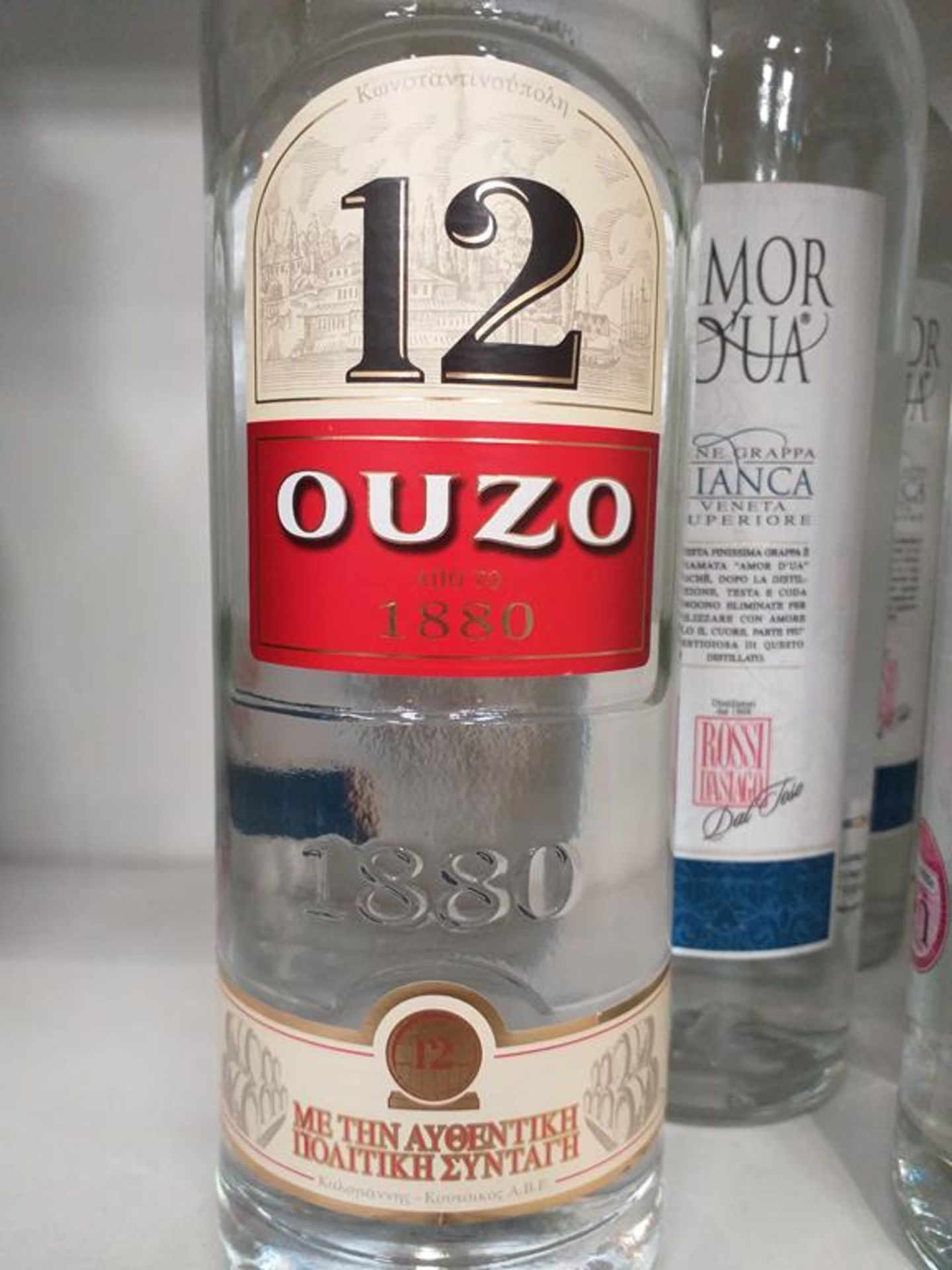 Three bottles of Amor D'ua Bianca Fine Grappa, a bottle of Iseo Sambuca and a bottle of '12 Ouzo' - Image 2 of 7