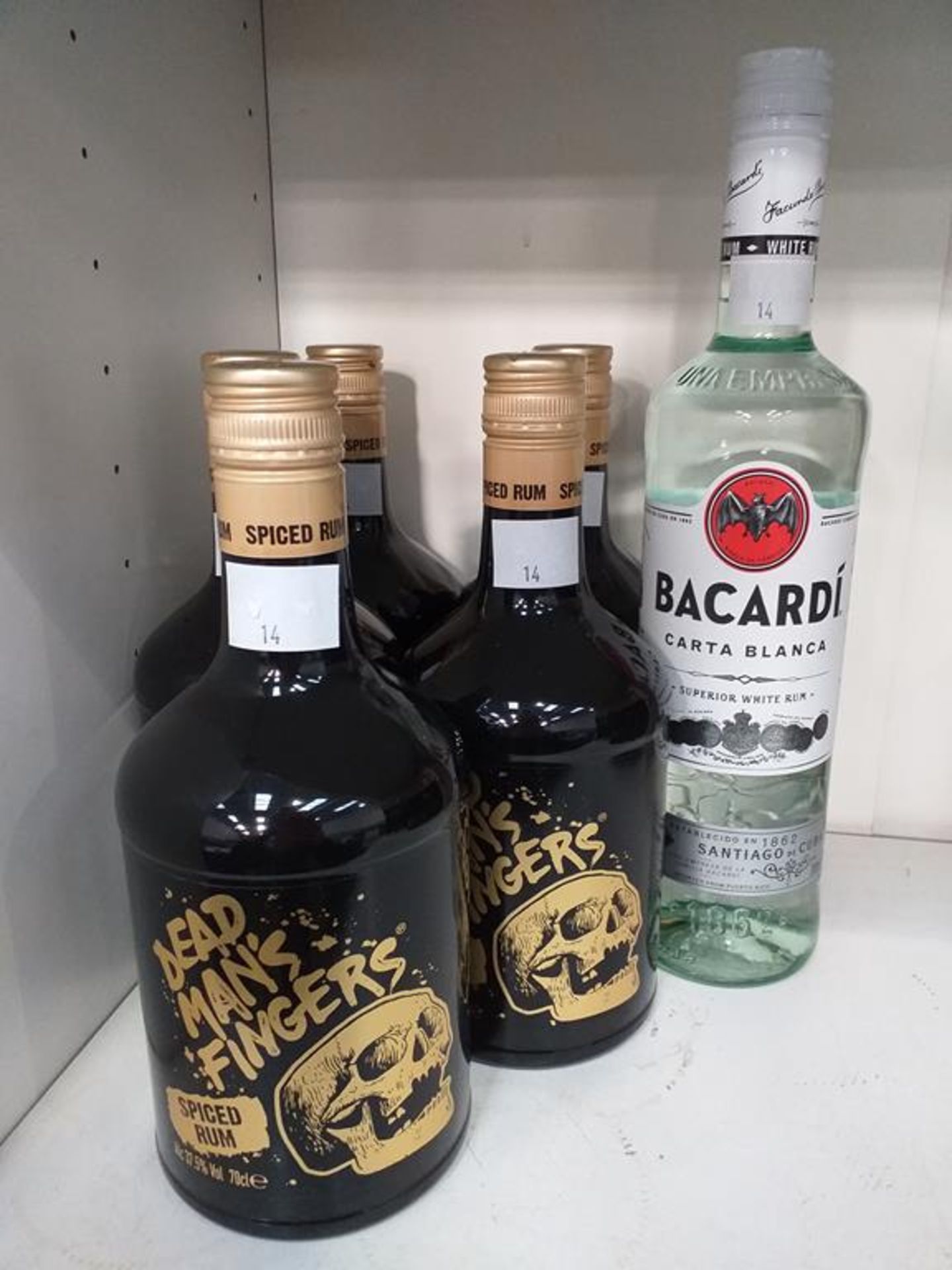 Five bottles of Dead Man's Fingers Spice Rum and a bottle of Bacardi Carta Blanca white rum