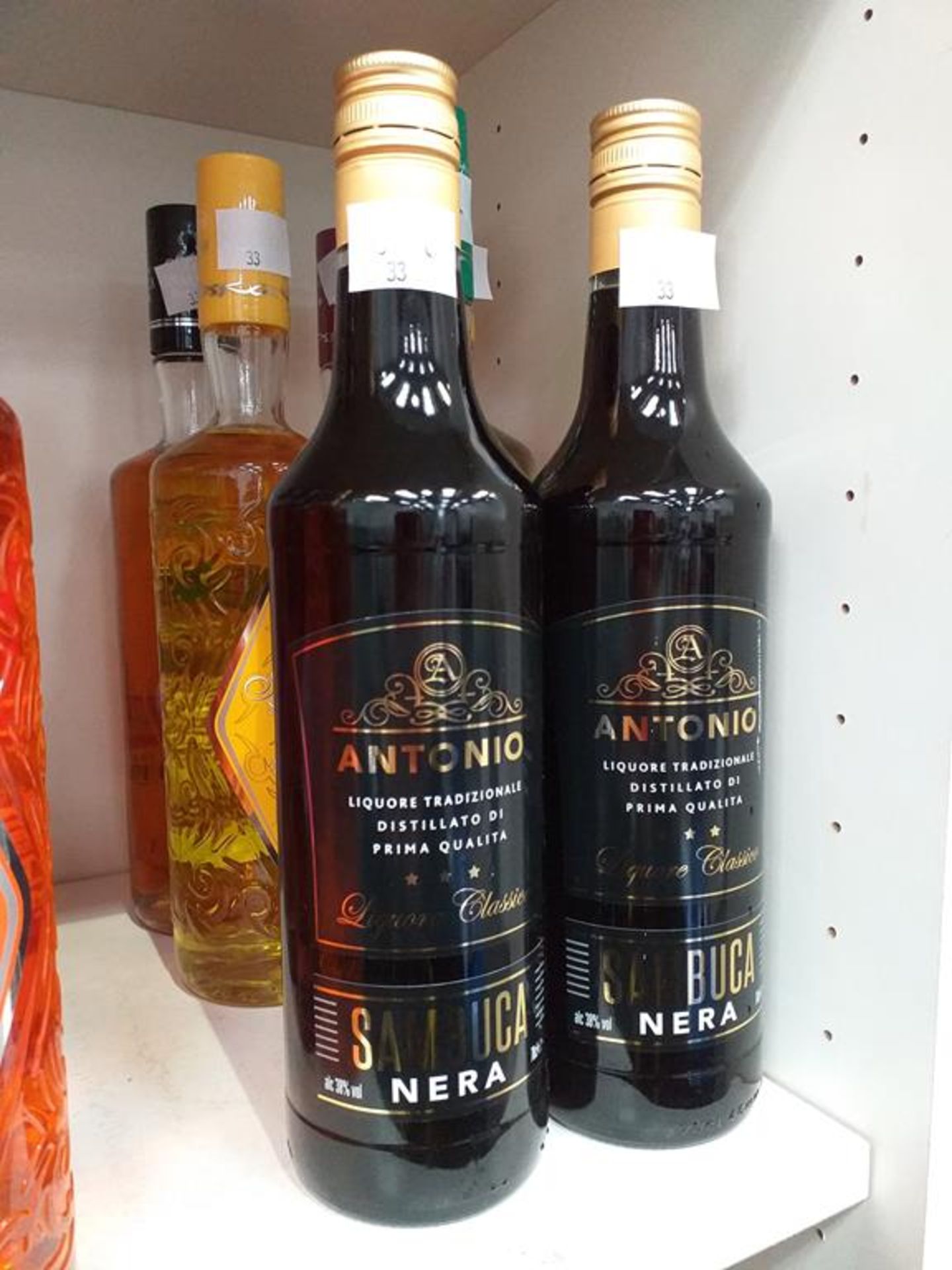 Five bottles of Antica Sambuca liqueur in five different flavours (Amaretto, Raspberry, Banana, Tro