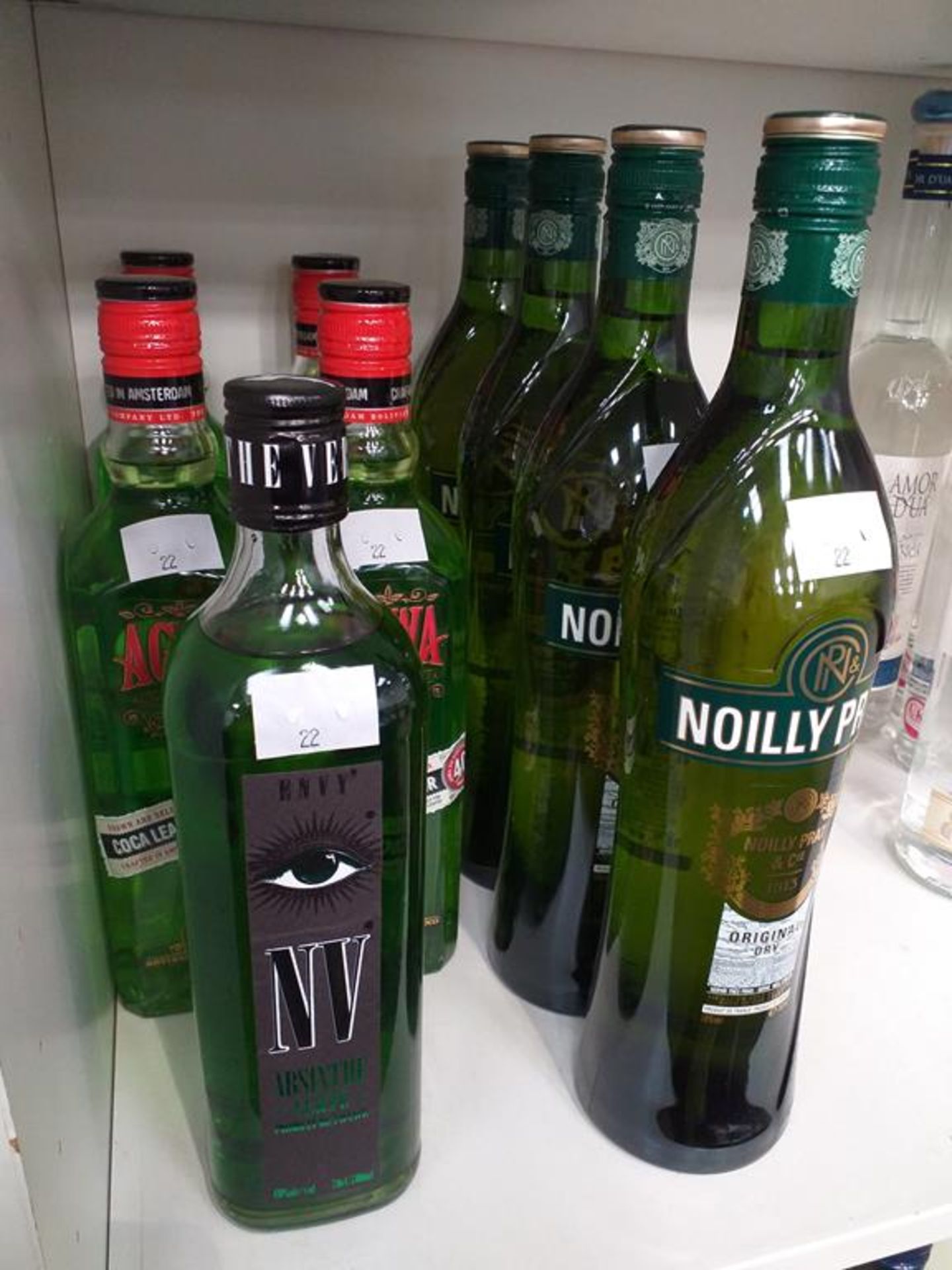 Four bottles of Noilly Prat Vermouth, four bottles of Agwa Coca Leak Liqueur and a bottle of Envy Ab