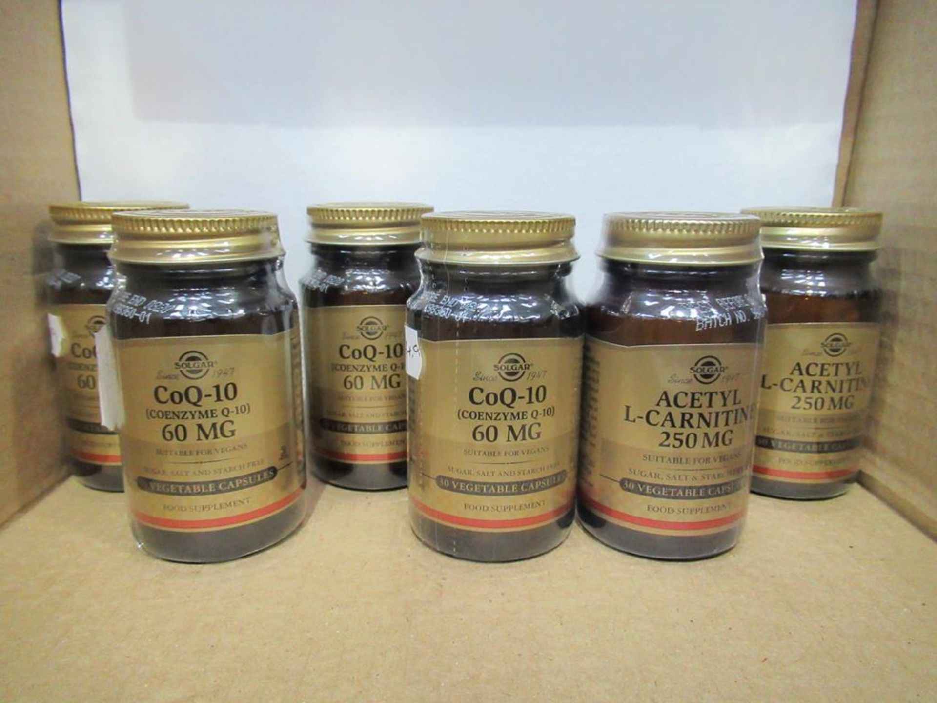 6 x Solgar supplement capsules of CoQ-10(4x) and Acetyl L-Carnitine (2x)