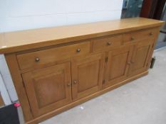 A Large sideboard with three drawers and four doors