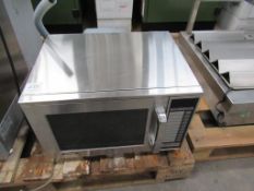 A Sharp model No R-24AT commercial microwave oven
