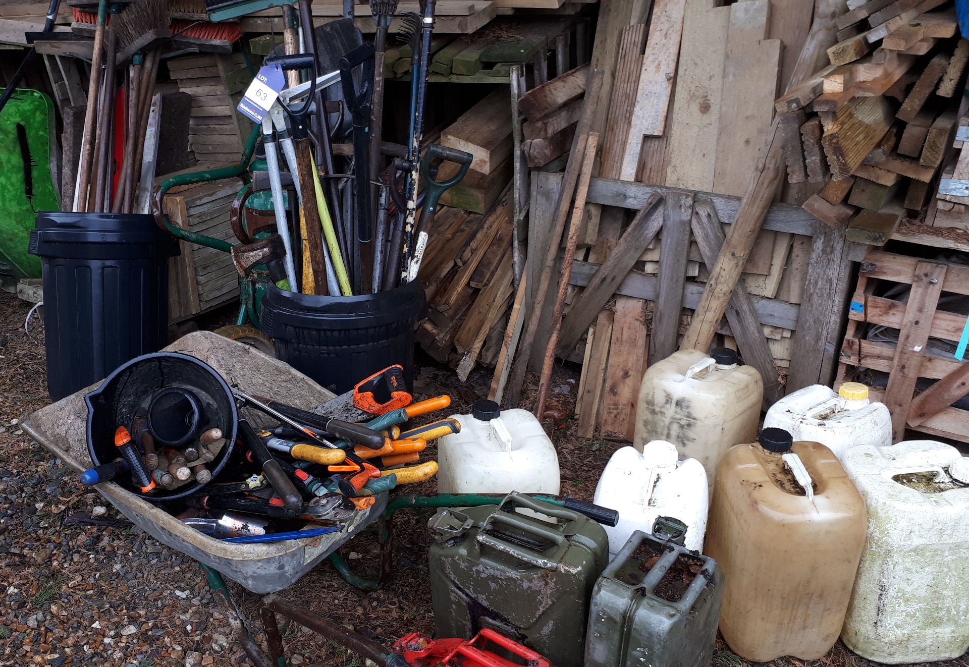 Assortment of handtools, and fuel containers